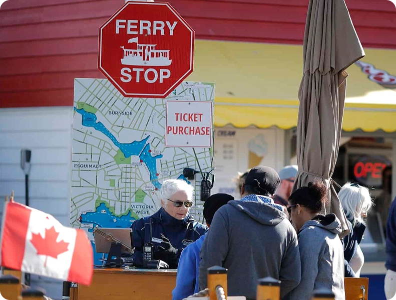 a group of people standing in front of a sign